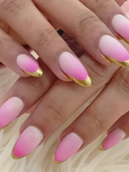 Another view of the eye-catching matte pink ombré and gold chrome tip combination.