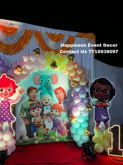 The Cocomelon theme can be customized with different characters. This setup features Nina and the elephant, along with a light-up number '1'.