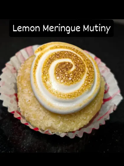 This is my Lemon Meringue Bombolini, a little burst of sunshine. It's a soft, baked doughnut filled with tangy lemon curd and topped with a swirl of fluffy, torched meringue for that classic toasted flavour.
