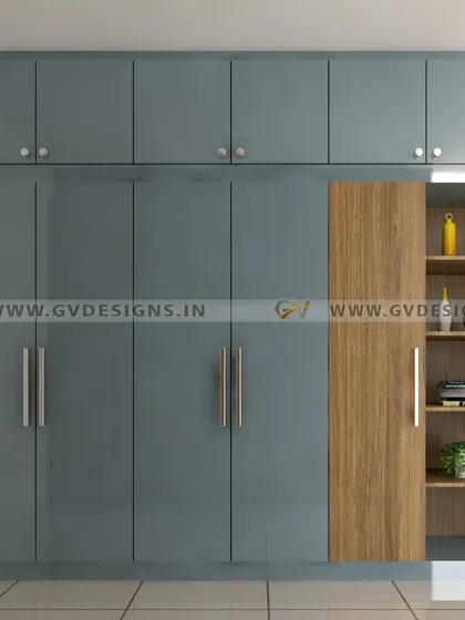 This floor-to-ceiling swing wardrobe combines a captivating blue hue with warm wooden accents on the side-open storage unit. The design offers generous storage capacity with a harmonious blend of colors and textures.
