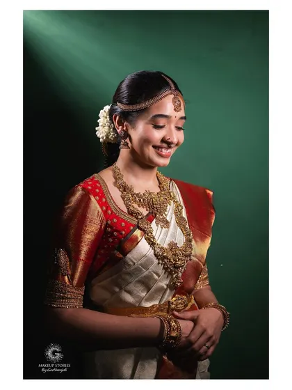 The gentle smile of a happy bride. Priyanka's look was all about celebrating her natural features, creating a light and airy feel that was perfect for her beautiful outdoor wedding at The Tamarind Tree.