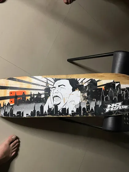 An older custom skateboard I did with a city skyline and a screaming character. I can work with any theme you've got in mind.