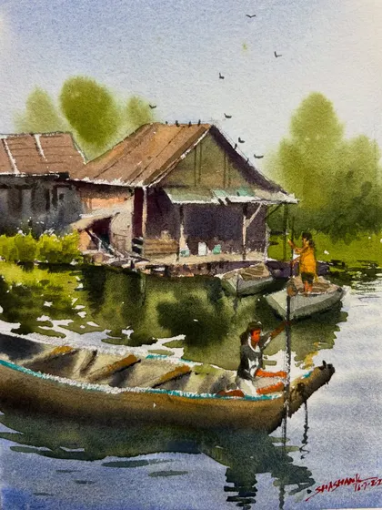 The finished watercolor piece of boats by a lake house. This was a demonstration for an online class on painting water reflections.