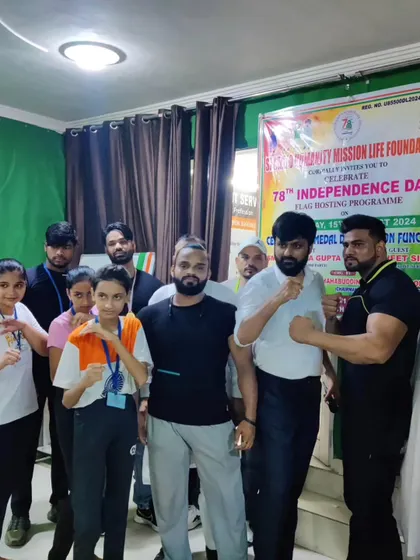 My students and I in a fighting stance during our 78th Independence Day celebration. We train to protect ourselves and honor our country.