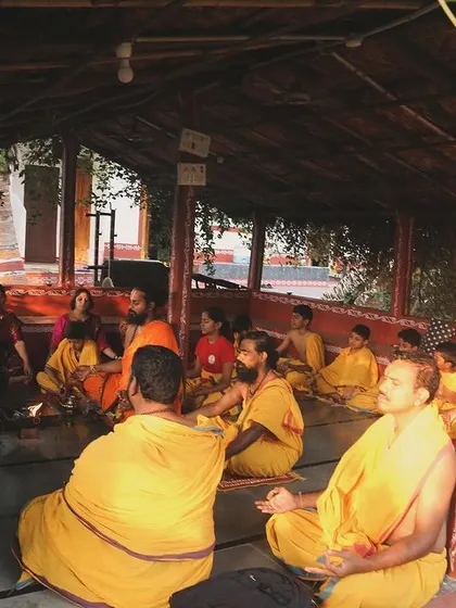 A moment of quiet contemplation and discourse. As part of the warrior philosophy course, we gather to discuss teachings from Vedic texts, connecting the physical practice to its spiritual roots.