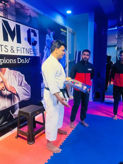 A moment of exchange and respect with the President of MMAFI at our dojo.
