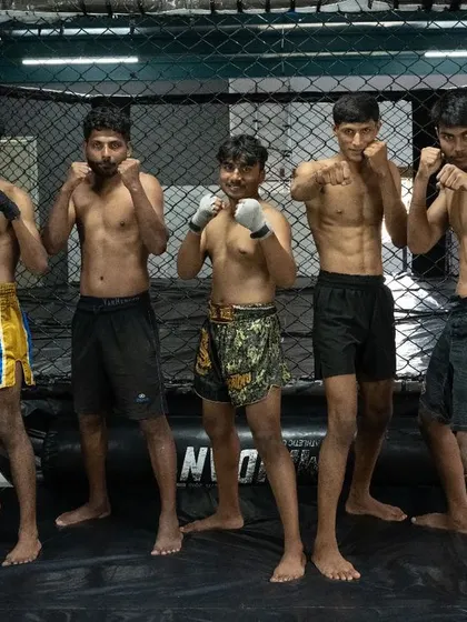 Strength in unity. A group of our fighters ready for training, showcasing the physique and determination built in our gym.