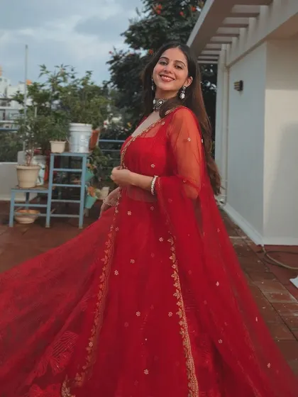 A final, beautiful shot of the client in her stunning red lehenga.