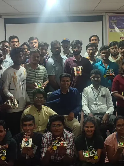 A proud group of college students showcasing the robots they built during our one-day workshop. In just a few hours, they went from components to a fully functional machine.