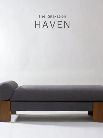A full view of the daybed, showcasing its minimalist design and the bolster pillow for added comfort.