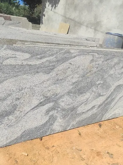 This is a 20mm granite slab with a dynamic grey and white pattern, perfect for making a statement with your flooring.