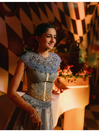 A beautiful portrait of the bride by a vintage-style piano, part of the eclectic and whimsical decor. I source unique props to bring my themes to life.