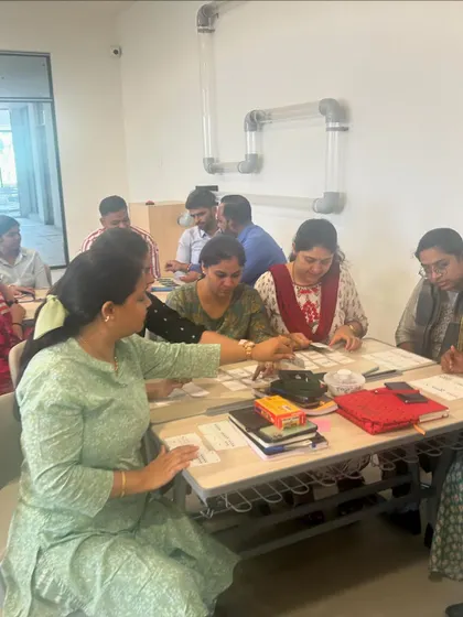 Teachers working with various math manipulatives during a professional development day. We explore how to use these tools to make abstract concepts concrete for young learners.