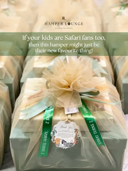 For a safari-themed second birthday, I created these elegant return gifts. Each box contains a leather organizer and custom stationery, beautifully wrapped in net with a personalized ribbon.