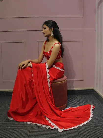 The full look of our red saree, which drapes beautifully and is perfect for any festive occasion.