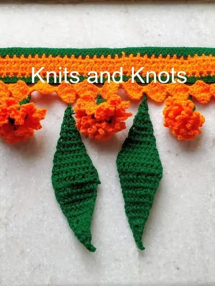 Another view of my popular orange marigold and mango leaf toran. It's lightweight, easy to hang, and can be gently washed to look fresh for every celebration.