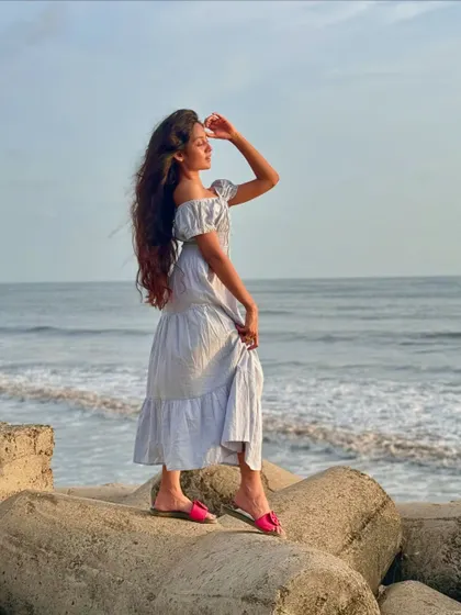 A side profile shot, enjoying the sea view. We make sure to visit beaches that offer stunning panoramic views.