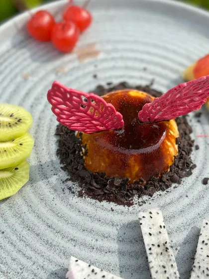 The intricate red sugar work on our panna cotta adds a touch of artistry to the dessert.