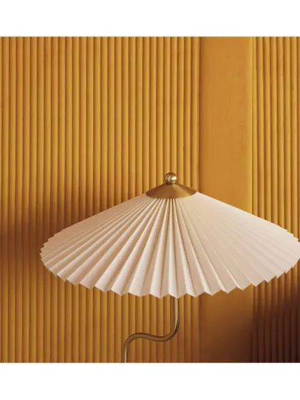 Inspired by classic column flutes, this textured wallpaper makes a bold design statement. The combination of its bright, warm colour and strong vertical lines adds both texture and architectural interest to a room.