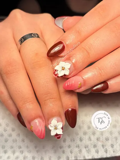 A beautiful combination of styles for a unique bridal look. This set features deep red nails, a soft pink ombré, and delicate white 3D flowers for a touch of romance.