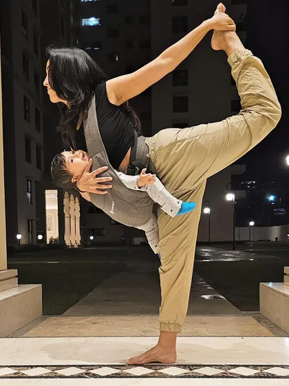 Living an intentional life means choosing your thoughts, actions, and words wisely to protect your energy. Here I am practicing Natarajasana (Dancer's Pose) with my baby in a carrier.