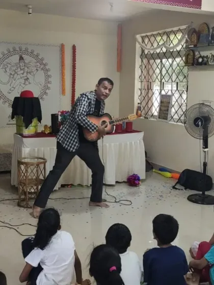 Sometimes a little music is all you need. Here, I'm playing the guitar for the kids, adding another layer of entertainment to a birthday magic show.