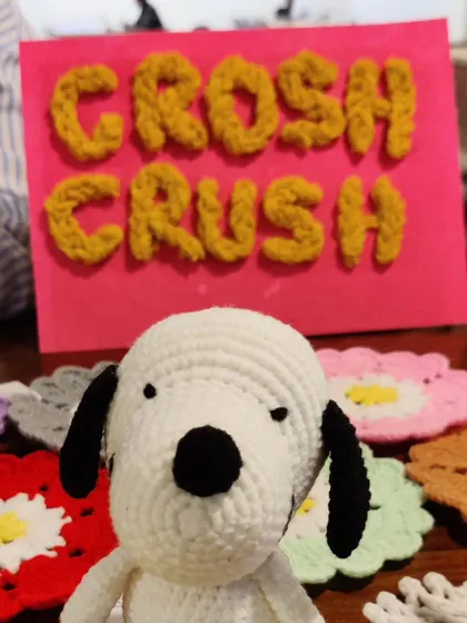 My small Snoopy plushie, acting as the mascot for my exhibition stall.