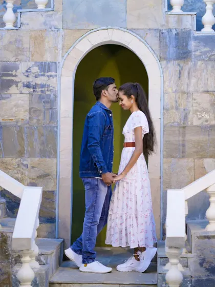 A tender forehead kiss, a classic and timeless romantic pose for any pre-wedding shoot.