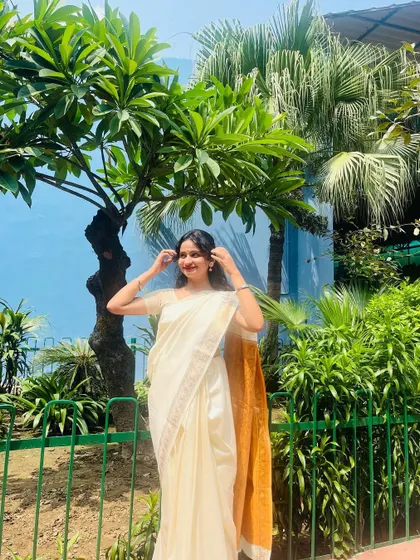 Dressed in a beautiful white and gold saree for a classical music event. I love embracing my desi vibes and dressing appropriately for traditional performances.