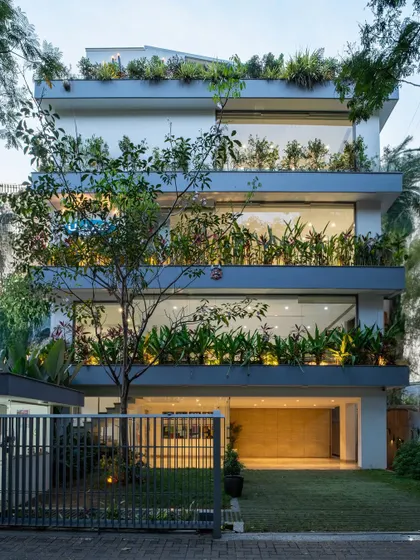 Where architecture breathes and nature ascends. This residential facade is a living sanctuary, with lush greenery cascading down terraces, integrating biophilic design into the heart of the urban landscape for a sustainable, healthy living experience.