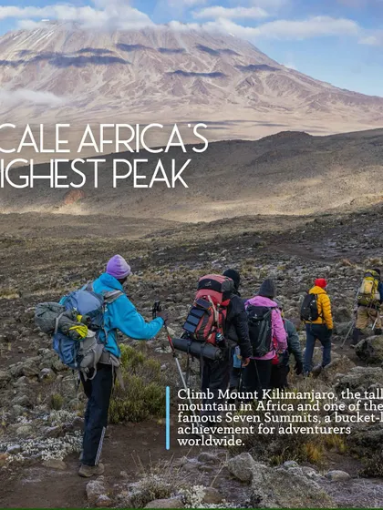 A team of trekkers on their way to scale Africa's highest peak. Kilimanjaro is a bucket-list achievement for adventurers worldwide, and we make it possible.