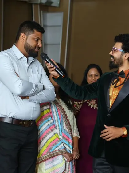 Engaging with a parent during the Little Elly school event. My interactive style ensures that I connect with the audience on a personal level.