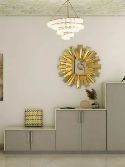 A stepped shoe cabinet design that adds visual interest while providing varied storage heights. The gold-toned mirror and chandelier add a touch of glamour to this practical entryway piece.