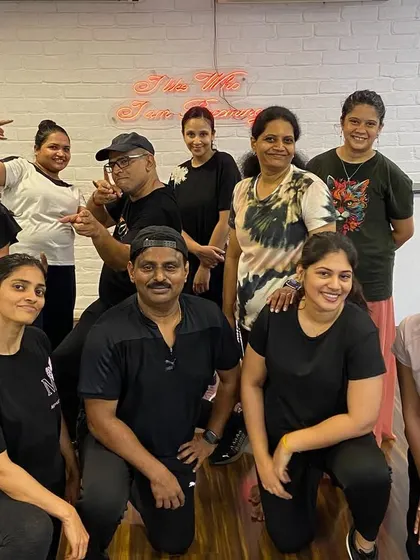 A group of our adult students posing after a rewarding dance fitness session. They are a testament to the fact that fitness can be fun and social.