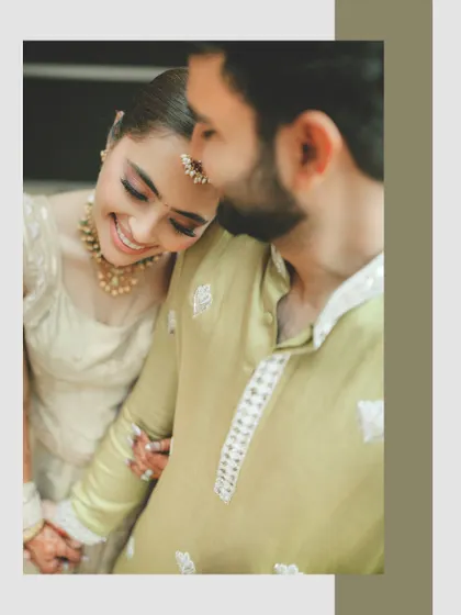 A tender moment of the bride resting her head on the groom's shoulder, her smile full of contentment. The simple framing keeps the focus on their bond.