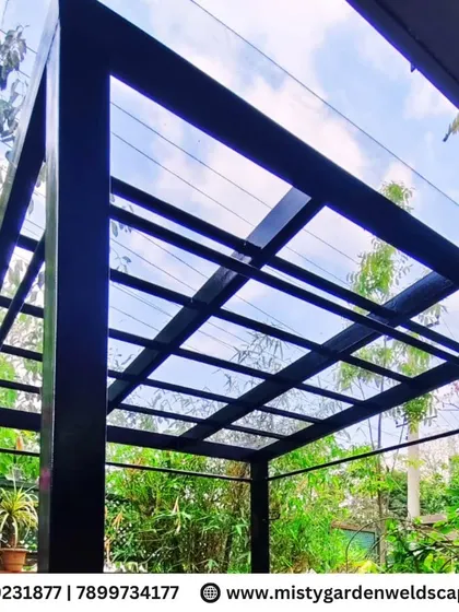 The view from underneath the compact pergola, highlighting its sturdy construction and the pleasant shade it provides, making the garden usable even on sunny days.