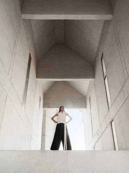 For this Payal Khandwala campaign, we shot at a stunning brutalist architectural site. The model's pose and the clean lines of her outfit complement the grand scale of the building.