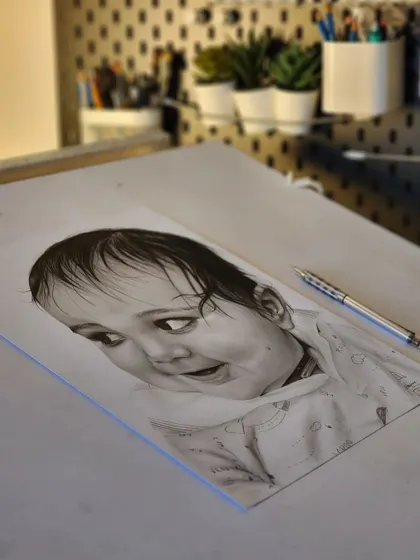 The baby portrait on my drawing table.