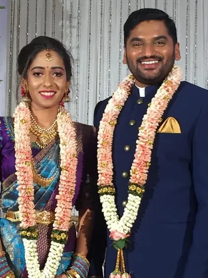 A smiling couple at their reception. Seeing the happiness of the pairs I match is the most rewarding part of my work.