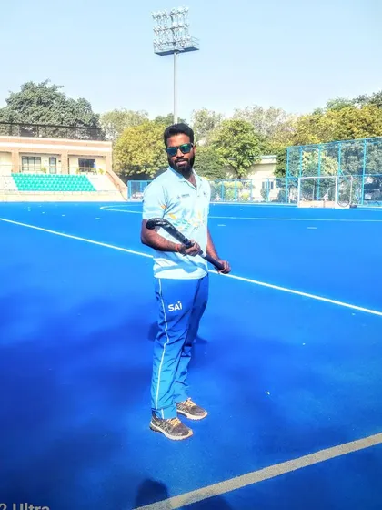 A moment of calm on the field. The blue turf is my office, my canvas, and my sanctuary.