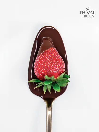 A spoonful of love. The simple yet perfect combination of a fresh, juicy strawberry dipped in our rich, dark couverture chocolate.