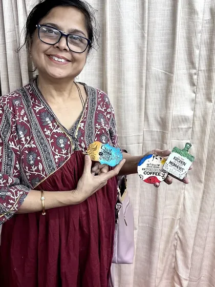 The smile of a happy creator! It's so rewarding to see participants enjoy the process and love their final products.