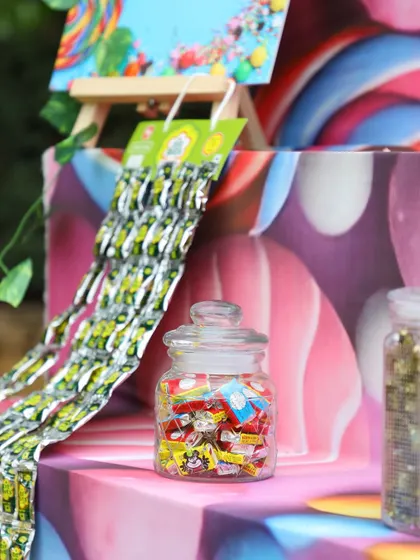 A close-up of the nostalgic candies, like phantom cigarettes and sweet treats in glass jars.