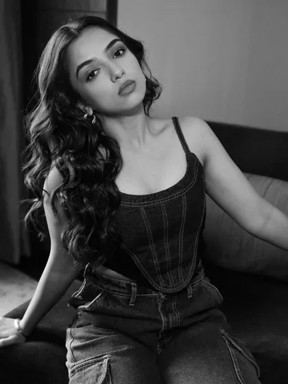 The same denim look in a moody black and white photo. This shows how a simple, well-styled outfit can be versatile enough for different photographic styles.