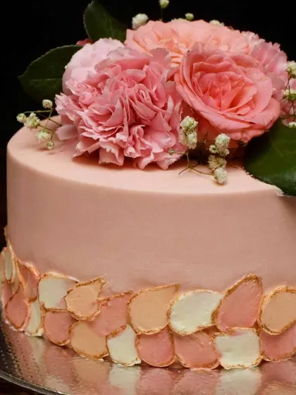 A close-up of the painted petal effect on the peach cake. I used different shades of peach, pink, and white with gold accents to create this delicate, textured look.