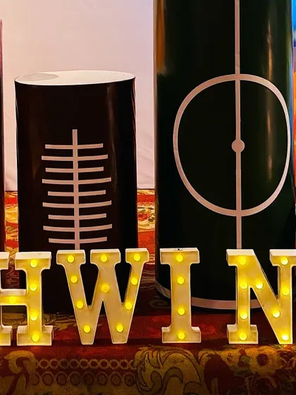 Sports-themed pedestals and marquee letters spelling out the birthday boy's name, 'Ashwin'.