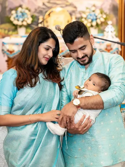 A serene portrait of new parents with their newborn. These sessions are handled with great care to capture the delicate features and peaceful moments of your baby's first days.