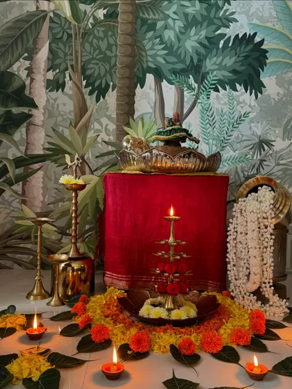 The complete Janmashtami decor, set against my vintage wallpaper. The contrast between the traditional setup and the modern backdrop is beautiful.