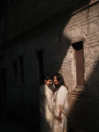 Using dramatic light and shadow in an urban alley. This creates a very cinematic and moody portrait.