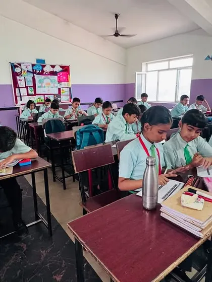 A teacher guiding students during an abacus class. Our certified trainer program ensures that instructors are well-equipped to manage and teach effectively.